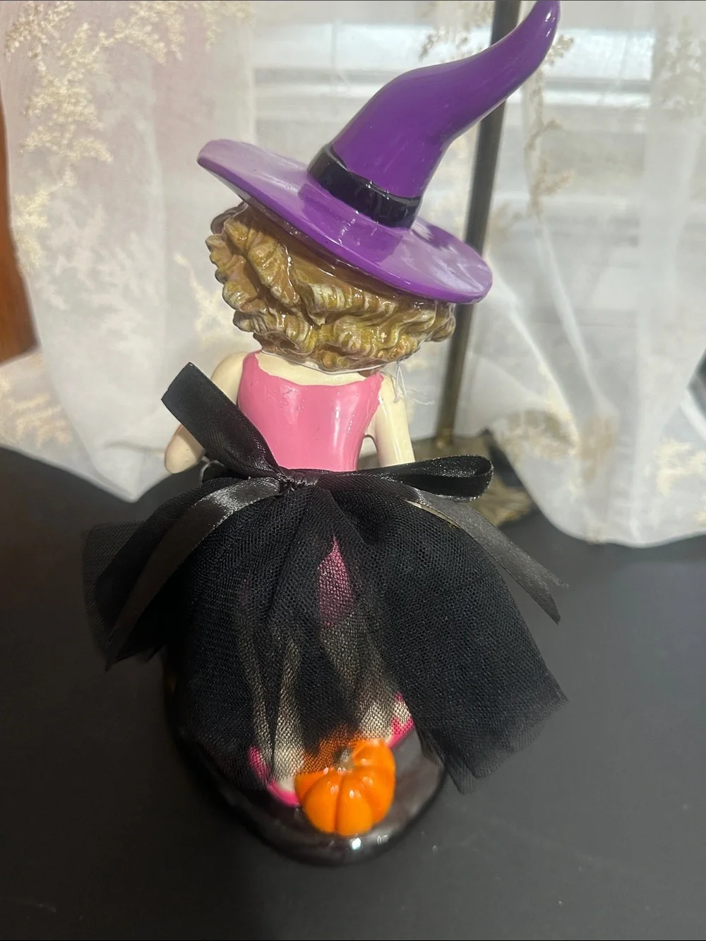 Ghoulish Halloween little girl with black cat decor